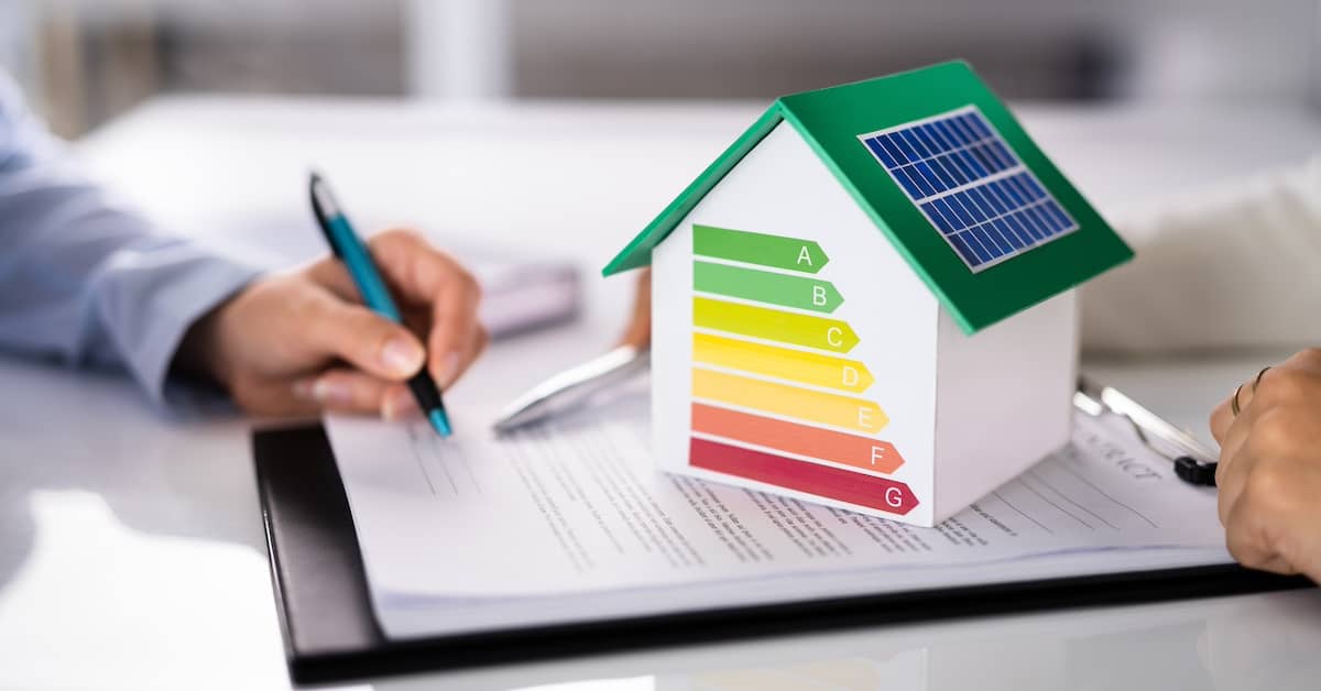 Energy auditor discussing results of energy assessment with homeowner | REenergizeCO